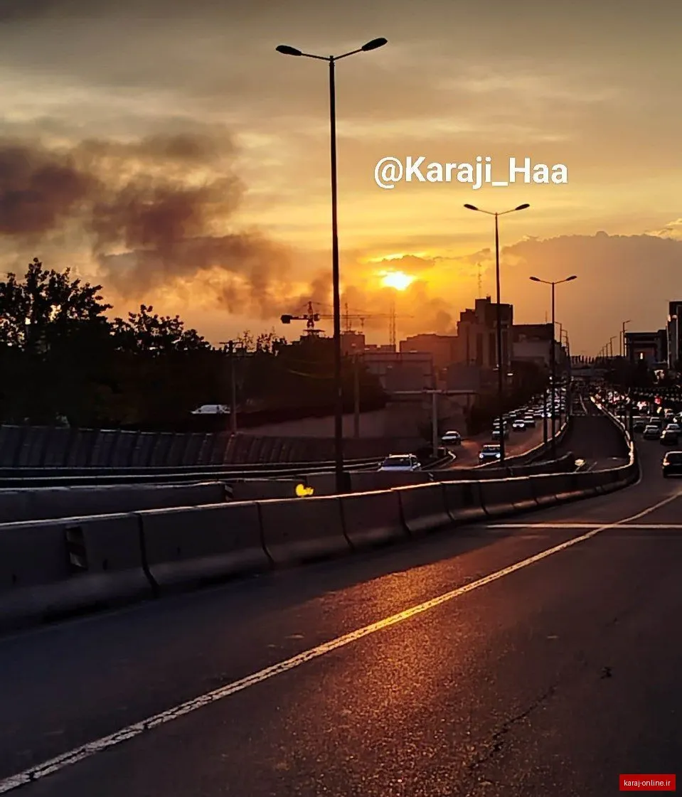 غروب زیبای کرج در ساعت ۱۸:۳۰؛ عکسی ثبت‌شده از بالای پل میدان سپاه در حالی که دود ناشی از حریق رو به کاهش و پایان است